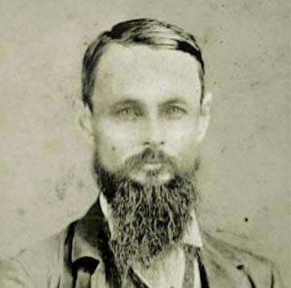 1874年，TCU创始人伦道夫·克拉克(伦道夫·克拉克)的黑白肖像，他是一位留着胡子的中年男子.